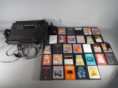 Atari - An Atari 2600 games console with controller and thirty game cartridges to include Donkey