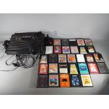 Atari - An Atari 2600 games console with controller and thirty game cartridges to include Donkey