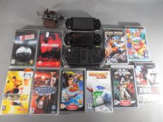 Playstation - Two Sony PSP hand held portable game consoles,