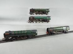 Four unboxed OO gauge steam locomotives to include two Triang R259 'Britannia' and two similar.