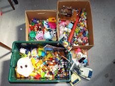 A large collection of predominately plastic childrens toy figures with an unboxed Marx Wombles