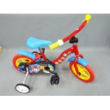 Dino - An unboxed Dino 12" inch frame Paw Patrol childrens bicycle.