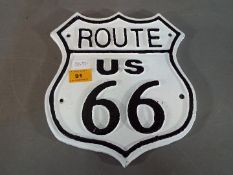 A cast iron Route 66 wall plaque (yr66)