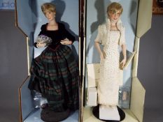 Two Franklin Mint Princess Diana porcelain collectors dolls contained in original boxes.