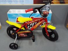 Dino - A boxed Dino Lightning McQueen 12" Childrens Bicycle.