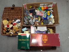 A collection of diecast model vehicles with a box of plastic childrens toy figures,