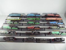 A quantity of static models of locomotives on plinths, models are unboxed, condition G to E.