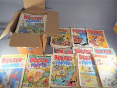 A box containing a quantity of vintage comics including Beezer, Topper,