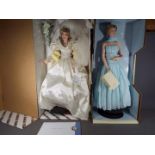 Two Franklin Mint Princess Diana porcelain collectors dolls contained in original boxes and