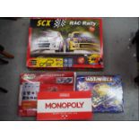Scalextric, SCX, Waddingtons and Others - A group of two boxed slot car racing games,