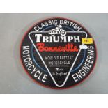 A cast iron Triumph wall plaque (ymctr)
