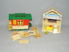 Sylvanian Families, Tomy - A collection of unboxed Sylvanian Family figures and accessories.