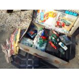 A vintage suitcase containing a large quantity of Scalextric, cars, track,