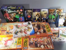 A collection of Wombles related jigsaw puzzles,