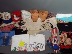 Popeye - A collection of Popeye related clothing and fabrics to include T shirts, towels, blanket.