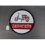 A circular Lambretta wall plaque,