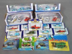 Oxford Diecast, Ertl, Fisher Price - 17 boxed diecast and plastic vehicles in various scales.