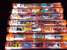 Matchbox Mattel Wheels - seven sealed tubes containing five model motor vehicles,