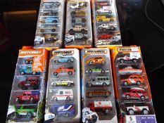 Matchbox on a Mission, Mattel seven sealed packs each containing five model motor vehicles,