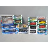 A collection of boxed diecast model vehicles in various scales to include Cararama and Oxford