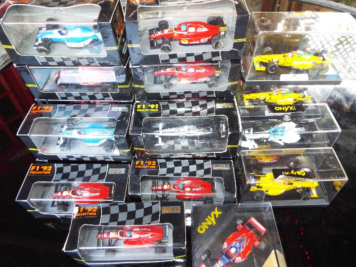 Onyx - 22 diecast model F1 racing cars with driver figures in rigid transparent cases,