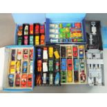 A collection of approximately 75 unboxed diecast model motor vehicles contained in collector's