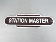 A cast iron station master sign,
