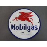 A cast iron Mobil sign.