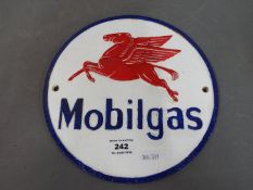 A cast iron Mobil sign.