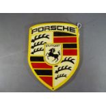 A cast iron Porsche wall plaque,