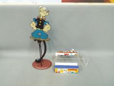 A limited edition 'Popeye' tin plate wind up speedboat,