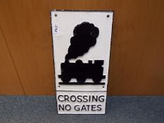 A large cast iron level crossing railway sign,