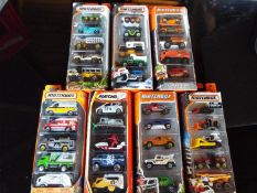 Matchbox on a Mission, Mattel seven sealed packs each containing five model motor vehicles,