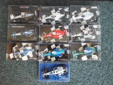 Minichamps - A group of 10 F1 diecast model racing cars in 1:43 scale by Minichamps. Lot includes B.