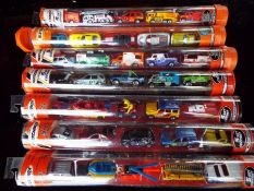 Matchbox Mattel Wheels - seven sealed tubes containing five model motor vehicles,