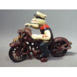 A cast iron model depicting Popeye riding a motorcycle, approximately 16.