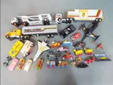 A quantity of unboxed, playworn diecast model vehicles to include Corgi, Dinky, Matchbox,