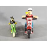 Two cast iron motorcycles with Mickey Mouse and Popeye (XM&P)