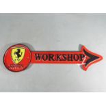 A cast iron arrow workshop sign, Ferrari,