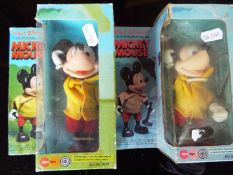 Walt Disney - two Mickey Mouse fully posable figures,