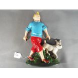 A cast iron doorstop depicting Tintin and his dog (xdstt),