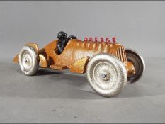 A novelty cast iron racing car with moving pistons (xrace)