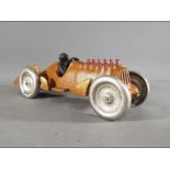 A novelty cast iron racing car with moving pistons (xrace)