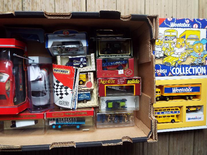 A box of mint diecast model motor vehicles to include Corgi Weetabix collection boxed set, Burago, - Image 2 of 2