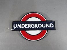 A cast iron Underground sign,