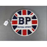 A circular cast iron BP sign,