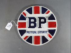 A circular cast iron BP sign,