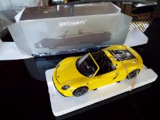 Minichamps - a 1:18 scale diecast model Porsche 918 Spyder,