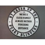 A cast iron Peaky Blinders sign