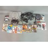 A Sony Playstation games console and a collection of Sony PSP games to include Killzone :